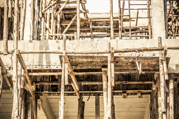 House under construction, showing the wooden scaffolding details.