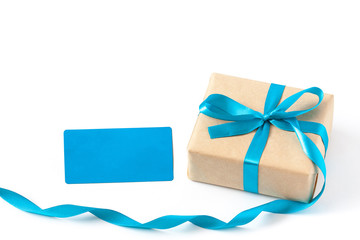 Gift box in wrapping paper tied with colorful ribbon and blank note card, festive packaging mock up	