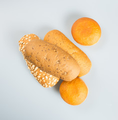 Hot dog bun and donut on a background.