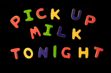 refrigerator magnets spell pick up milk tonight