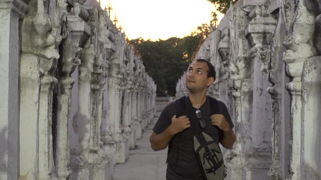 Male Tourist Visiting White Temple in Twilight, Myanmar