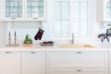 Fototapeta na wymiar Modern, bright, clean kitchen interior with stainless steel appliances in a luxury apartment.