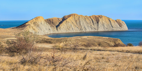 Sea bay surrounded with a mountain range.