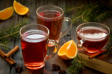 Red tea with orange fruit and spices