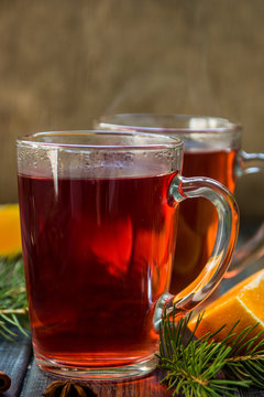 Red tea with orange fruit and spices