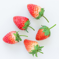 fresh strawberries on white in top view
