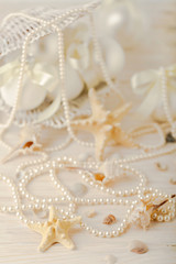 Christmas and New Year. Christmas-tree white toys in a marine style, seashells stones and starfish.