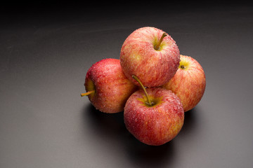 Red apples isolated on a black background