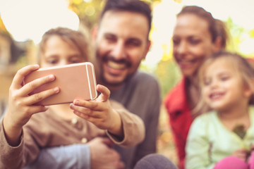 Lets have a picture all us. Focus on phone.