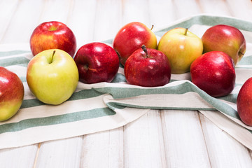 Sweet apples on wooden background