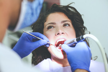 Young woman at dentist . Close up.