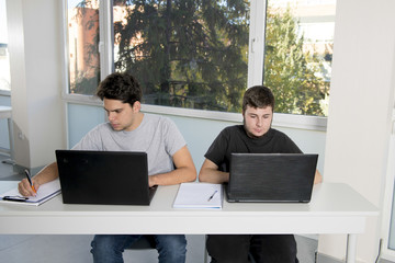 teenager university students working on school classroom with la