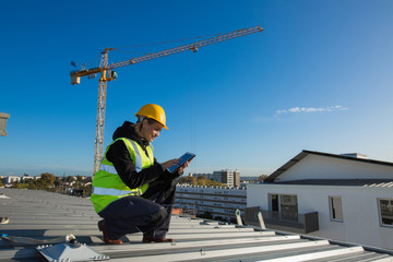 Woman engineer with safety hat is working at site