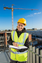 female engineer on the top of a construction site - 183579497