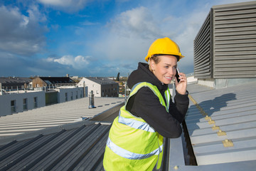 construction woman on rooftop