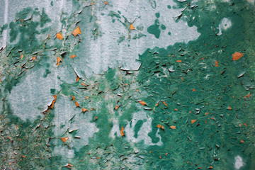 Wooden surface with cracked paint. Green paint. Vintage texture