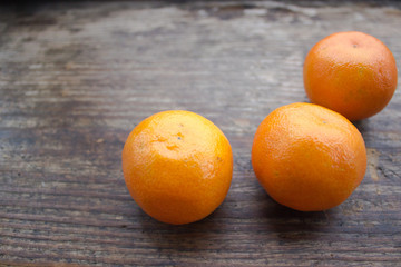 Christmas still life with mandarins on a wooden board