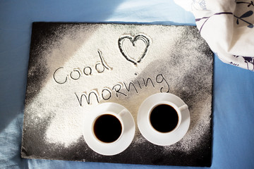 Obraz na płótnie Canvas good morning inscription flour on a board with cups of coffee, heart Valentine's day.