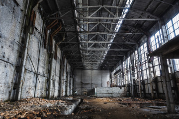 Big abandoned industrial hall or hangar of ruined factory or warehouse in Voronezh