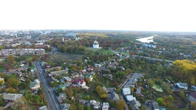 

 4K . Aerial. Over Christian church  dome or monastery in modern city. 
