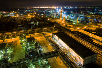 Fototapeta na wymiar large chemical plant at night with light aerial view