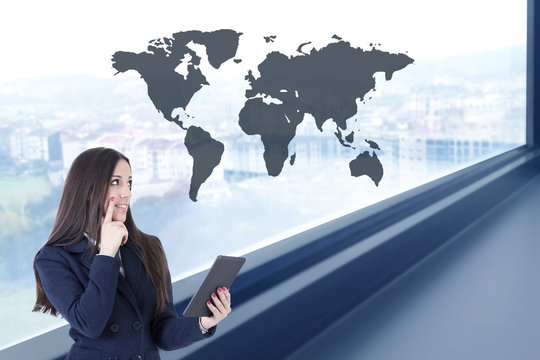 business woman with digital tablet in office with map