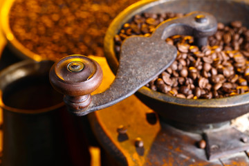 close-up of old coffee grinder and roasted coffee beans