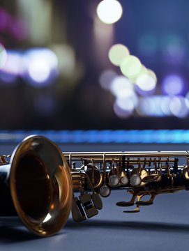 Saxophone on a background of night city.