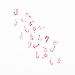 Traditional Christmas candy cane isolated on white background. Flat lay, top view
