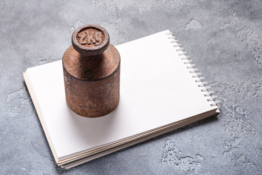 Antique weight mass used as paperweight