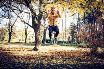 Man exercise jump squat. On the move.