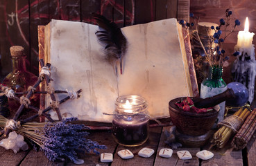 Witch book with pentagram, runes, magic objects and black candle. Occult, esoteric, divination and wicca concept. Mystic and vintage background - obrazy, fototapety, plakaty