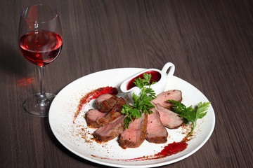 luxury dinner served on the table with glass of red wine