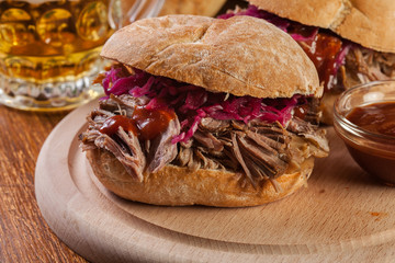 Pulled pork sandwich with red cabbage and bbq sauce