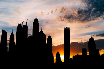 Dubai marina cityscape silhouette on sunset