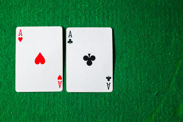 cards in poker, two aces on green background with copy space