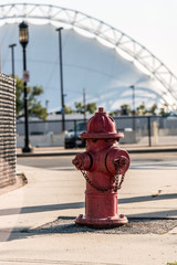 A red fire hydrant on a sidewalk in Boston Massachusetts USA in a city setting