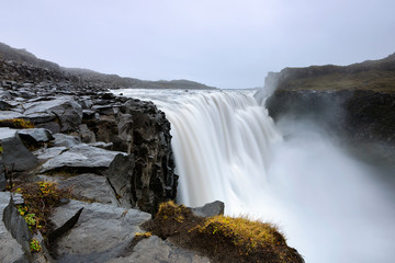 Dettifoss is a waterfall in Vatnajokull National Park in Iceland, and is the most powerful waterfall in Europe. Amazing landscape at sunrise.