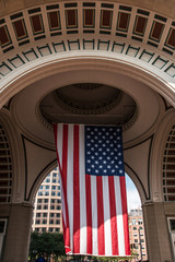Big US american Stars and Stripes Flag Hanging from inside Dome in Boston Massachusetts on sunny day