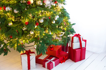 Christmas tree with gifts in Christmas living room. Beautiful New Year decorated classic home interior. Winter background