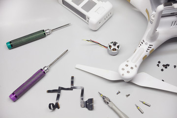 Repair maintenance drone, screws, screwdriver, tools, propellers