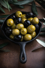 Olives with olive branch and olive oil, view from above