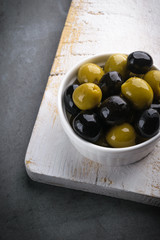 Olives with olive branch and olive oil, view from above