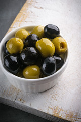Olives with olive branch and olive oil, view from above