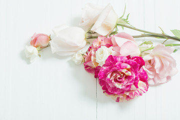 beautiful roses on wooden background