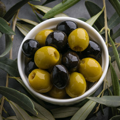 Olives with olive branch and olive oil, view from above