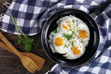 fresh fried  eggs sprinkled with parsley