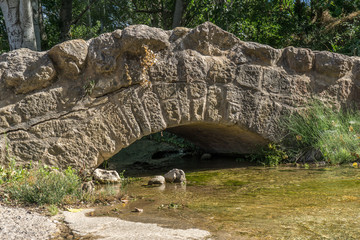 Small Medieval stone bridge on a stream in Loarre Spain
