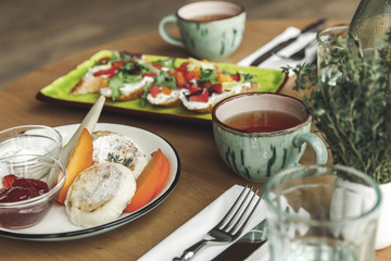 close-up view of delicious healthy breakfast with tea on table