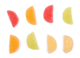 Colorful jelly sugar candies isolated on white background, top view